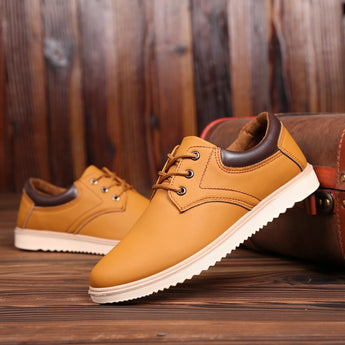 Navy blue men's low-top leather sneakers with yellow accents, in size 44, designed for style and durability.