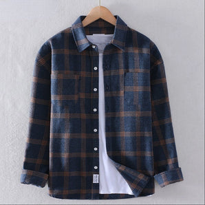 Navy blue men's plaid flannel shirt with long sleeves, featuring a button-down design and collar, in size XL.