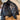 Navy blue quilted puffer jacket with a high collar, featuring long sleeves and a sleek design suitable for winter wear. The jacket is displayed against a wooden floor background.