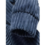 Navy blue ribbed cowl neck hoodie for men featuring long sleeves and pleated design, worn by a male model pairing it with denim pants.
