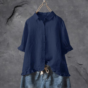 Navy blue ruffled hem 3/4 sleeve button front vintage blouse on hanger, displaying collar and shoulder details, variant Marine blue in size 5XL.