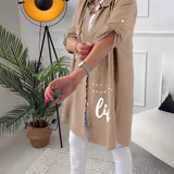 
A casual women's summer outfit featuring a navy blue shirt dress with a collar and sleeves, cinched at the waist.
