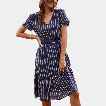 Navy blue striped V-neck sleeveless blouse being worn by a person, showcasing the shoulder and neckline details, styled for an office casual look in a marine blue XL size.