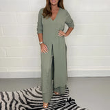 Navy blue wide-leg jumpsuit with 3/4 sleeves designed for plus size evening wear.