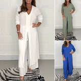 Navy blue wide-leg jumpsuit with 3/4 sleeves, designed as plus size evening wear, showcasing a tailored fit with defined waist and elegant neckline.
