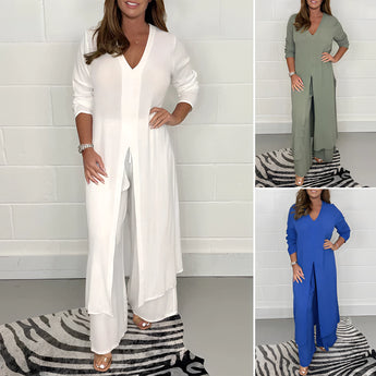 Navy blue wide-leg jumpsuit with 3/4 sleeves, designed as plus size evening wear, showcasing a tailored fit with defined waist and elegant neckline.