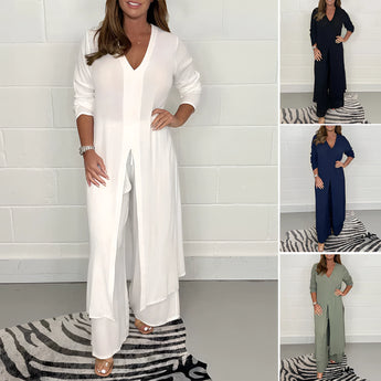 Navy blue wide-leg jumpsuit with 3/4 sleeves, designed as plus size evening wear, featuring a fashionable silhouette with a defined waist and elegant shoulder detailing.