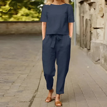 Navy blue women's casual summer jumpsuit featuring short sleeves and a lightweight design, displayed on a mannequin or model.
