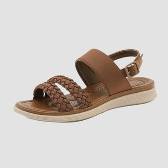 Brown women's comfort sandals with a braided strap design, featuring a lightweight construction.