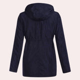 Navy blue women's lightweight hooded parka designed as a water-resistant jacket with a collar and long sleeves, shown in a solid color pattern.