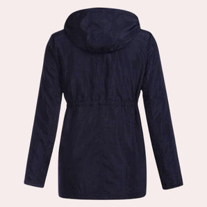Navy blue women's lightweight hooded parka designed as a water-resistant jacket with a collar and long sleeves, shown in a solid color pattern.