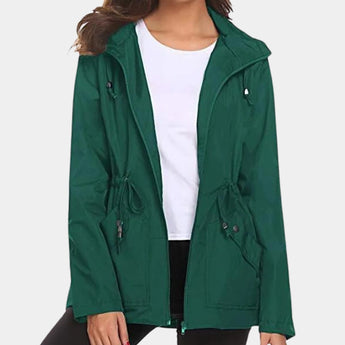 Green women's lightweight hooded parka with water-resistant fabric, featuring long sleeves, a collar, and a fitted design in XL size.