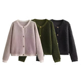 Women's navy bouclé jacket featuring a chunky knit texture, long sleeves, a collar, and button closures, designed as a warm winter cardigan with a sophisticated blazer-style fashion design.