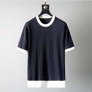 Navy pleated men's t-shirt with ribbed texture and crewneck style, displayed on a clothes hanger.