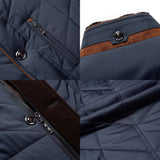 Navy quilted men's winter jacket featuring a faux fur collar and thermal insulation, showcasing button details and long sleeves.
