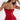 A woman wearing a strapless red ruched beach dress with an adjustable bust, showcasing a stylish and summery look.