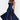 Navy ruched beach dress in marine blue, featuring an adjustable bust, modeled by a woman. The dress is a one-piece garment with a sleeveless design, highlighting the shoulders and arms.