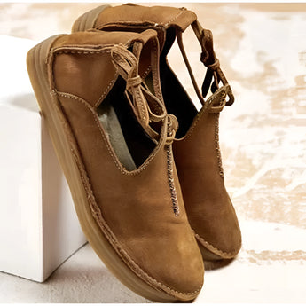 Men's navy suede chukka boots with a stylish design, featuring a mix of brown and beige tones, crafted from natural leather materials.