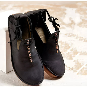 Navy suede chukka boots for men with stylish leather design, featuring a synthetic rubber sole and elegant fashion details.