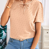 Navy tie-front blouse with polka dot ruffle sleeves, modeled in apricot color, size XL(44).