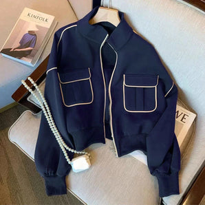 Navy women's stylish short jacket with zip closure, featuring double pockets and long sleeves, displayed on a clothes hanger in a marine blue color, size 2XL.