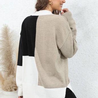 Neutral tone color-block sweater for women, featuring a trendy fall knitwear design with distinct sections of color, long sleeves, and a comfortable fit around the shoulders and neck.