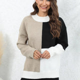 Neutral Tone Color-Block Sweater worn by a smiling woman, showcasing the trendy fall knitwear with distinct blocks of colors on the sleeves and body, featuring a comfortable collar and stylish design.