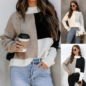 Neutral tone color-block sweater featuring a trendy design, displayed on a mannequin; the sweater showcases a stylish combination of black, white, and neutral colors suitable for women's fall knitwear.