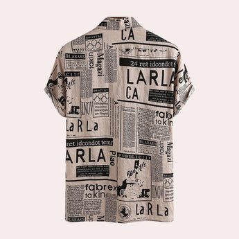 A modern vintage urban fashion top featuring a newspaper print design with various text and illustrations, long sleeves, and a distinct pattern on the fabric.