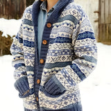 Nordic pattern wool-blend cardigan with chunky knit texture, featuring a snowy background. The cardigan showcases a tartan design with a collar and long sleeves, suitable as winter outerwear.