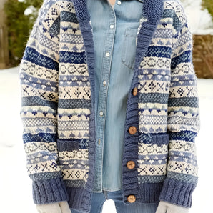 Chunky knit wool-blend cardigan featuring a Nordic pattern in black and white, designed as winter outerwear with long sleeves and a cozy neckline.