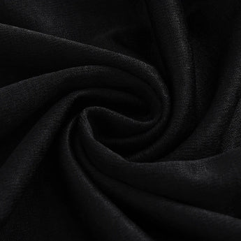 Off-shoulder black mini dress with long sleeves and pockets for women, set against a dark background.