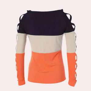 Off-shoulder knit top featuring a color block design with unique ring sleeves, showcasing a stylish and modern look.