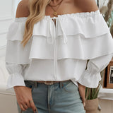 White off-shoulder ruffle blouse with a bow-tie front, featuring loose sleeves and a flowy design suitable for casual and fashion-forward looks in size XL.