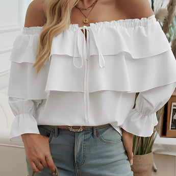White off-shoulder ruffle blouse with a bow-tie front, featuring loose sleeves and a flowy design suitable for casual and fashion-forward looks in size XL.