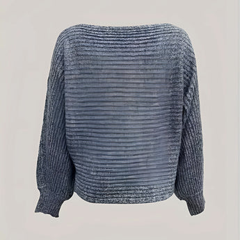 
A cozy off-shoulder sweater featuring cropped balloon sleeves, made from woolen knitwear in an electric blue color.