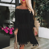 Off-shoulder white lace dress featuring long sleeves and a boho summer style, highlighting the neckline and waist details.