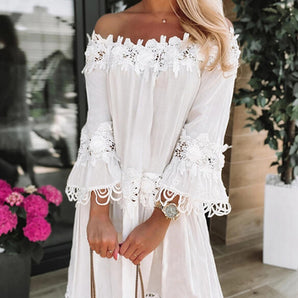 Off-shoulder white lace dress with long sleeves, featuring a boho summer fashion design.