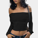 Black off-shoulder long sleeve crop top in XL, styled with matching shorts, showcasing stylish fall fashion with emphasis on shoulder and neckline design.