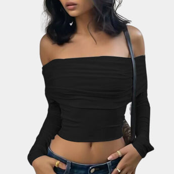 Black off-shoulder long sleeve crop top in XL, styled with matching shorts, showcasing stylish fall fashion with emphasis on shoulder and neckline design.