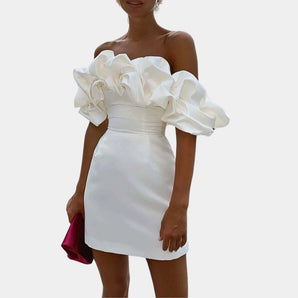 Off-shoulder white mini dress with ruffled sleeves, showcasing a chic design perfect for party wear, featuring a fitted waist and elegant neckline.
