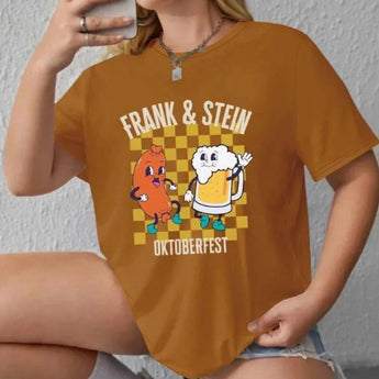 Cartoon Oktoberfest-themed T-shirt featuring the phrase "Frank & Stein Beer Festival," shown in a coffee color and size XL, with a focus on the sleeve and neck area, worn by a person.
