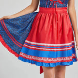 Oktoberfest women's blue and red dirndl featuring an authentic Bavarian dress style, with white blouse underneath, blue bodice with red accents, and traditional shoulder and waist detailing.