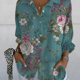 
An olive green women's blouse featuring a bird print, with a V-neck and ruffle sleeves.