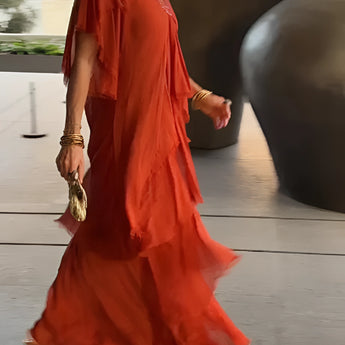 Olive green bohemian tiered midi dress with vintage chic design, featuring short sleeves and a fitted waist, worn by a fashion model.