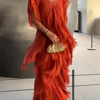 Olive Green Bohemian Tiered Midi Dress featuring a vintage chic design, modeled in an orange variant, size 5XL. The dress has a flowing one-piece silhouette with a defined waist, stylish sleeves, and a tiered skirt that falls to a midi length.