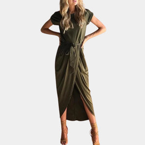 Olive green cap sleeve wrap dress in a light green shade, featuring a tie at the waist, showcased on a mannequin or model highlighting the dress's casual summer midi style, with focus on the shoulder and arm areas.