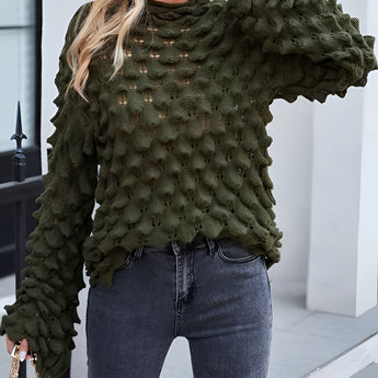 Olive green chunky knit pullover with puff sleeves, showcasing a stylish fall fashion look. The pullover features a textured design and is complemented by black sunglasses, highlighting its fashionable appeal.