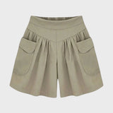 Olive green high-waisted women's safari shorts featuring a persimmon color accent in size 5XL, designed with convenient pockets and a stylish fashion-forward look.