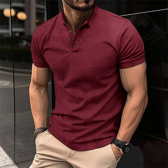 Men's fitted polo shirt in a wine red color, featuring short sleeves and a collared neckline, displayed on a mannequin or model.